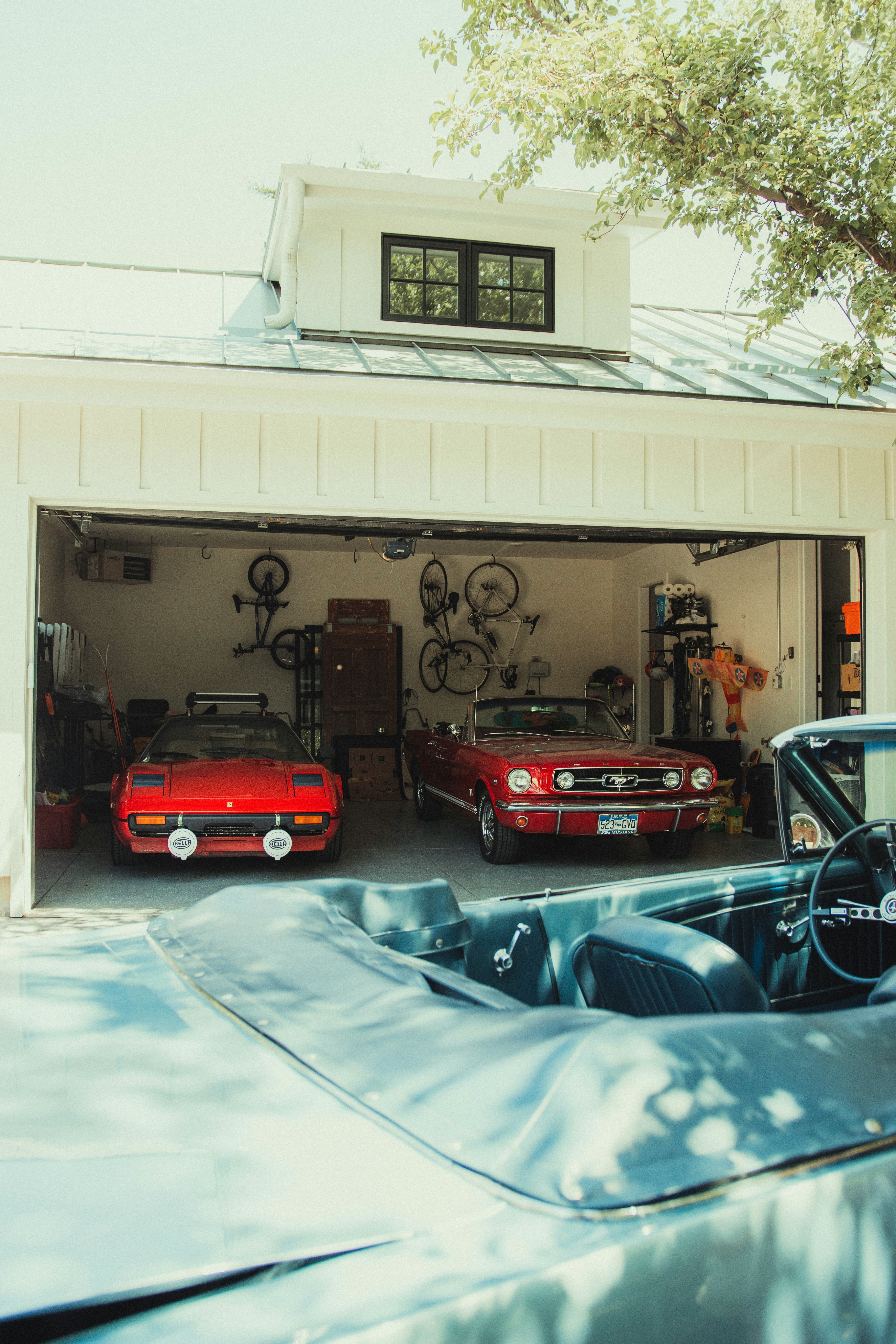 red and black car parked in garage